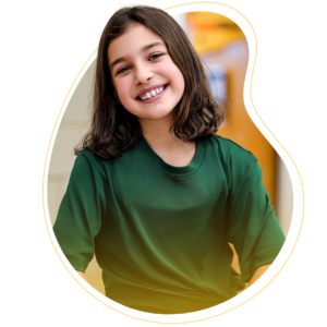 A grade school girl smiling